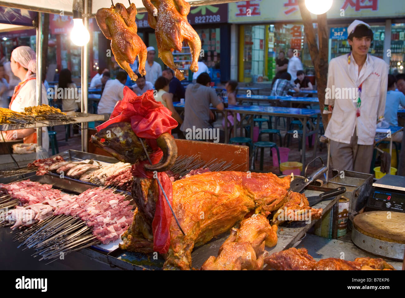 Roasted lamb and chicken at the night market in Urumqi in Xinjiang province in China. Stock Photo