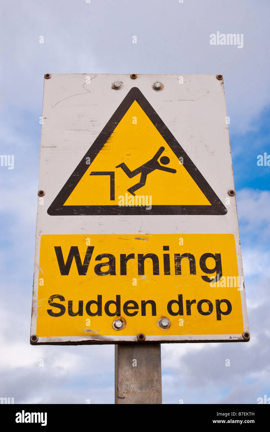 Warning sudden drop sign Stock Photo