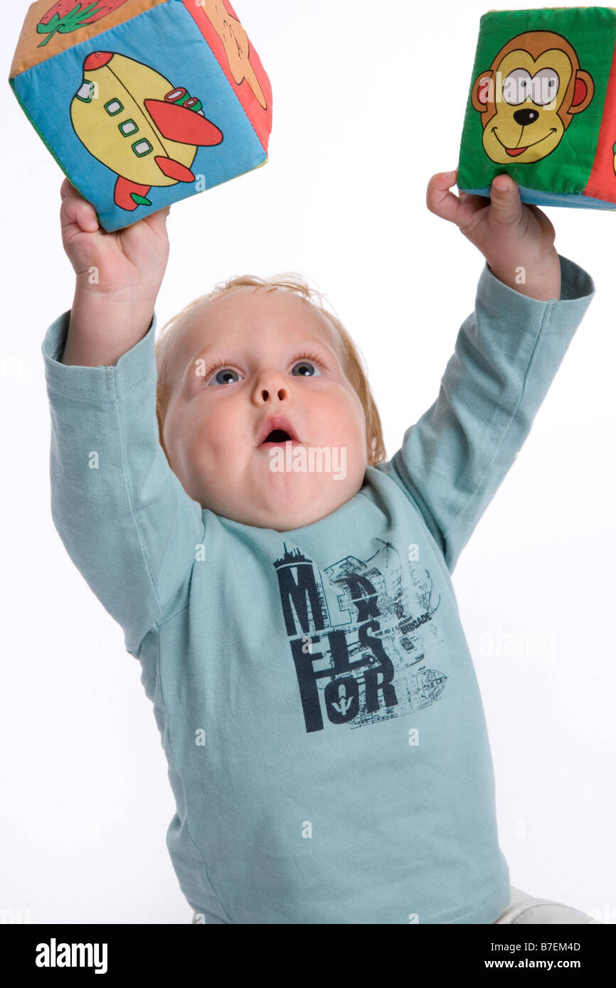 Toddler with two soft bricks Stock Photo