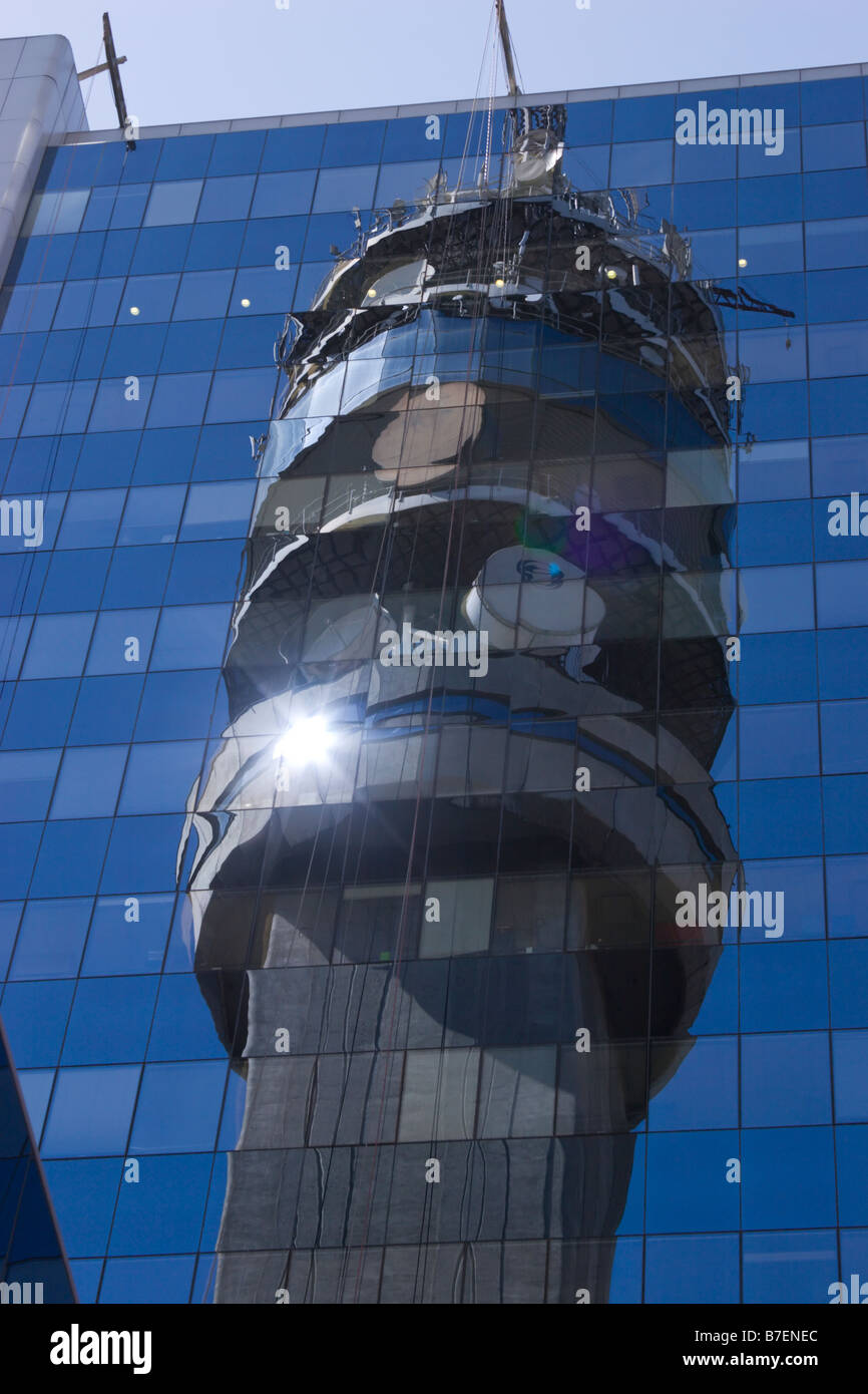 communications tower reflection reflected in glass facade Santiago Chile Stock Photo