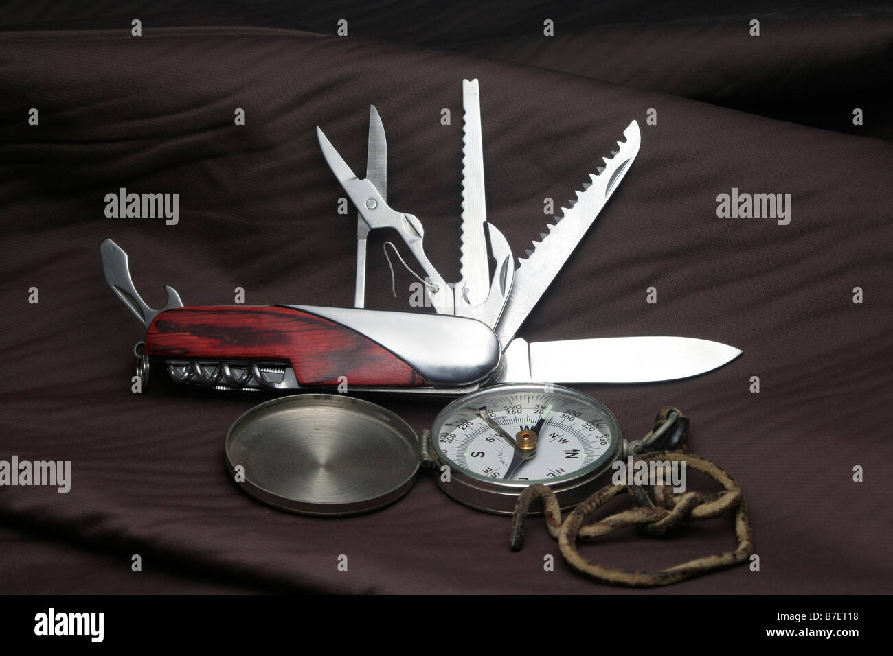 Old compass and multifunction pocket knife Stock Photo Alamy