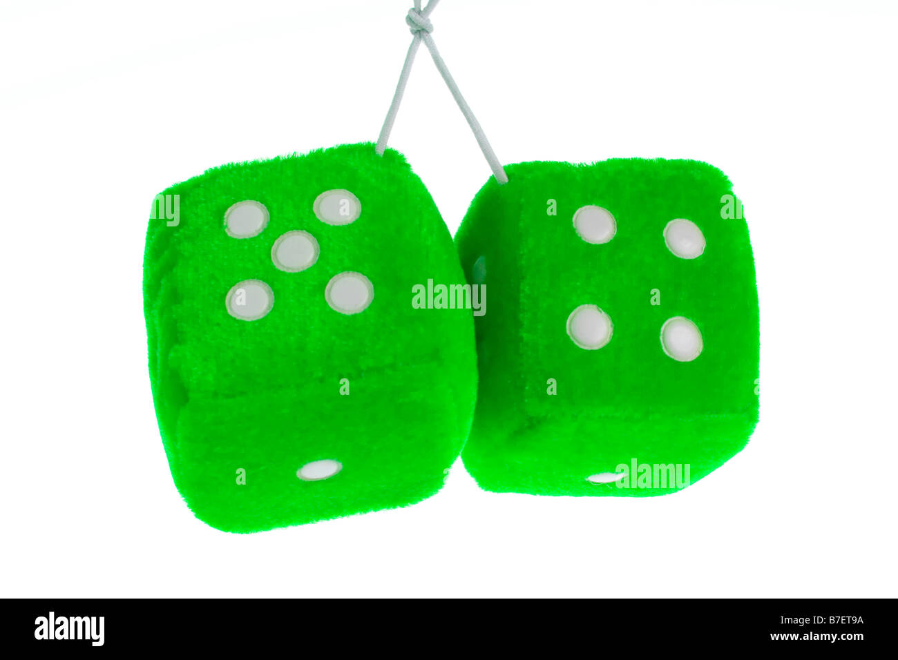 Pair of hanging furry dice on a pure white background. Stock Photo