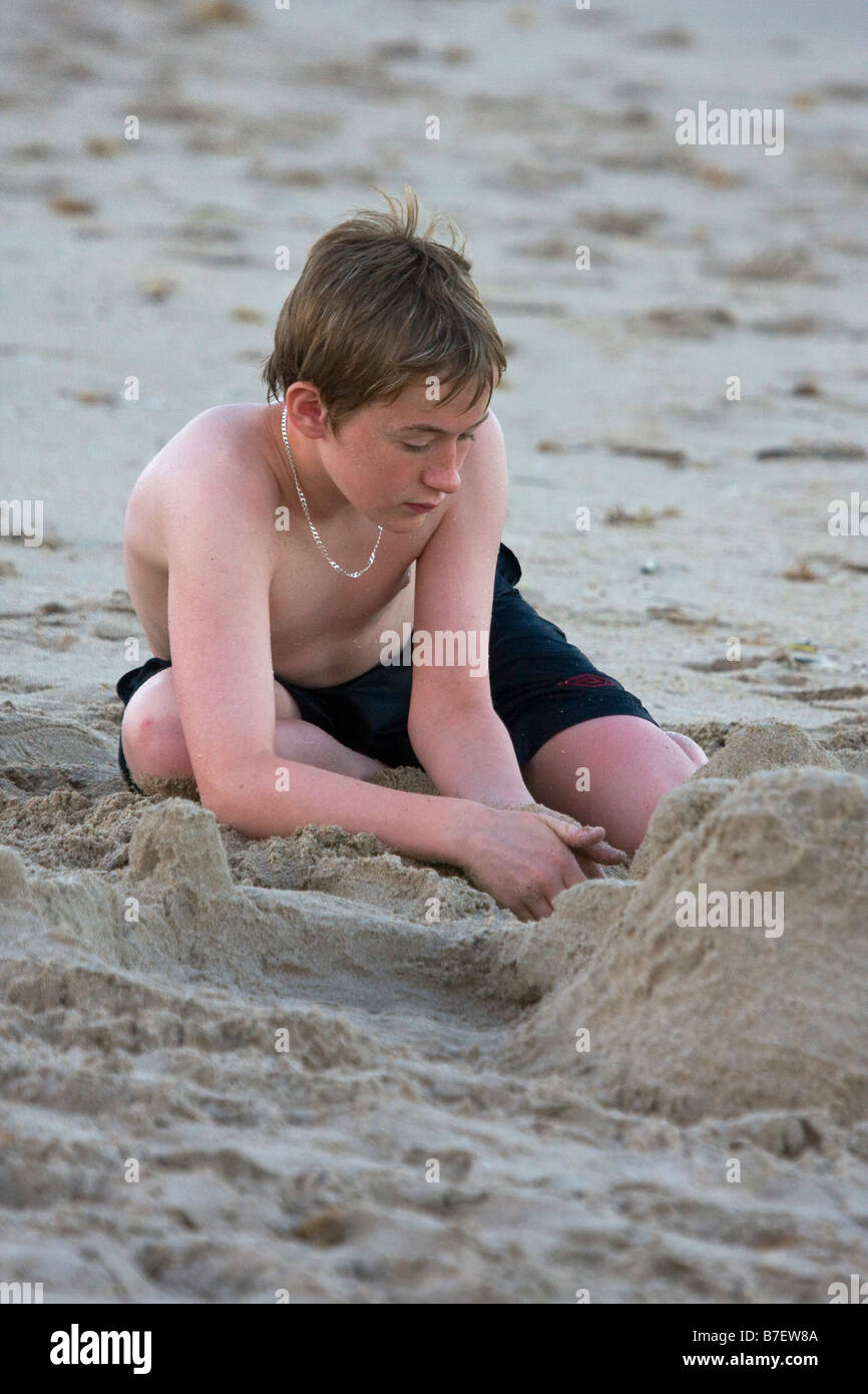 Young boy plays in sand on beach, Florida, USA Stock Photo