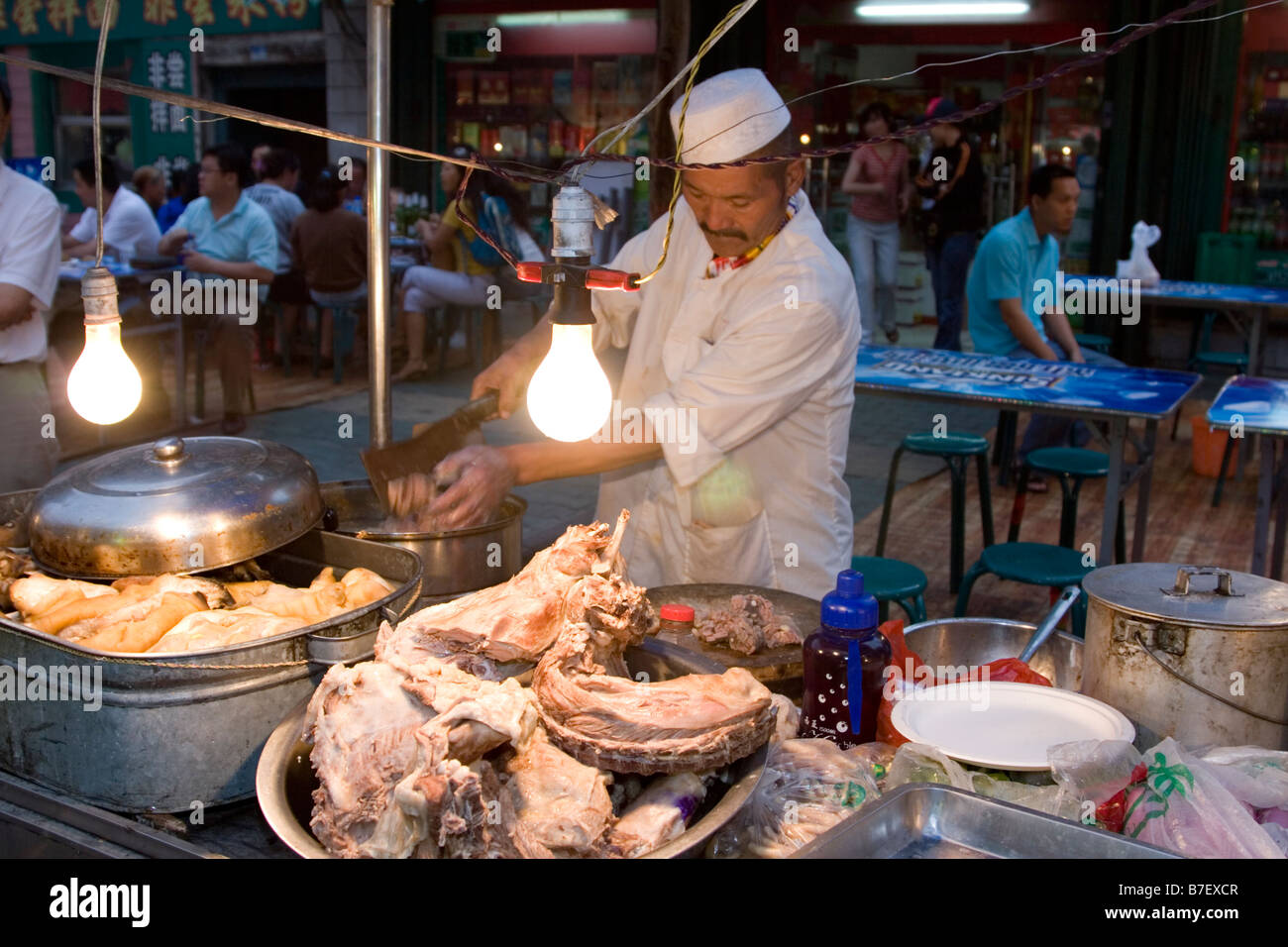 Offal and innards of sheep cooked for diners at the Uyghur night food market in Urumqi capital of Xinjiang China Stock Photo