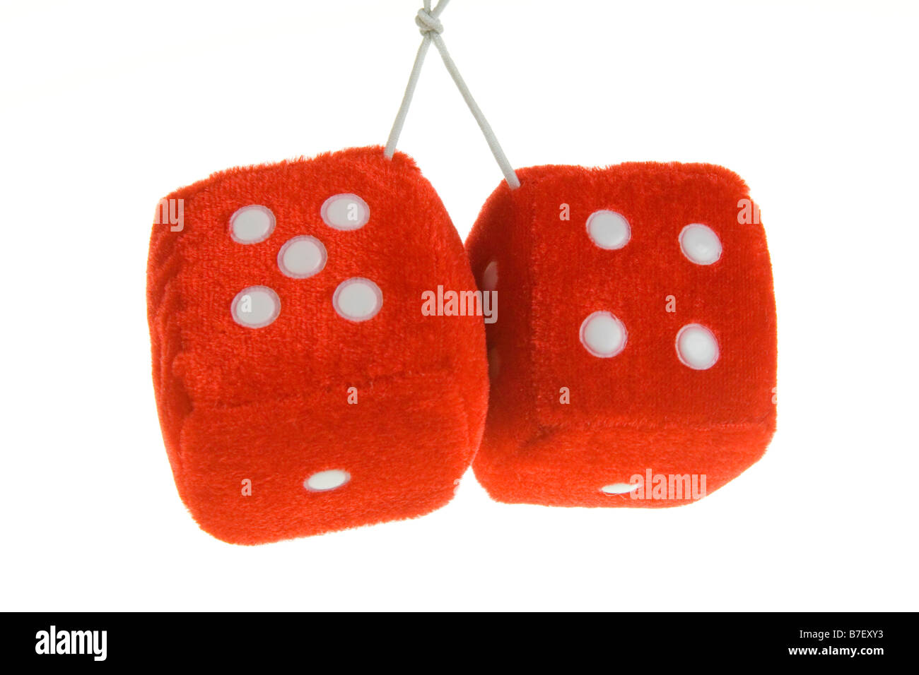 Pair of hanging furry dice on a pure white background. Stock Photo