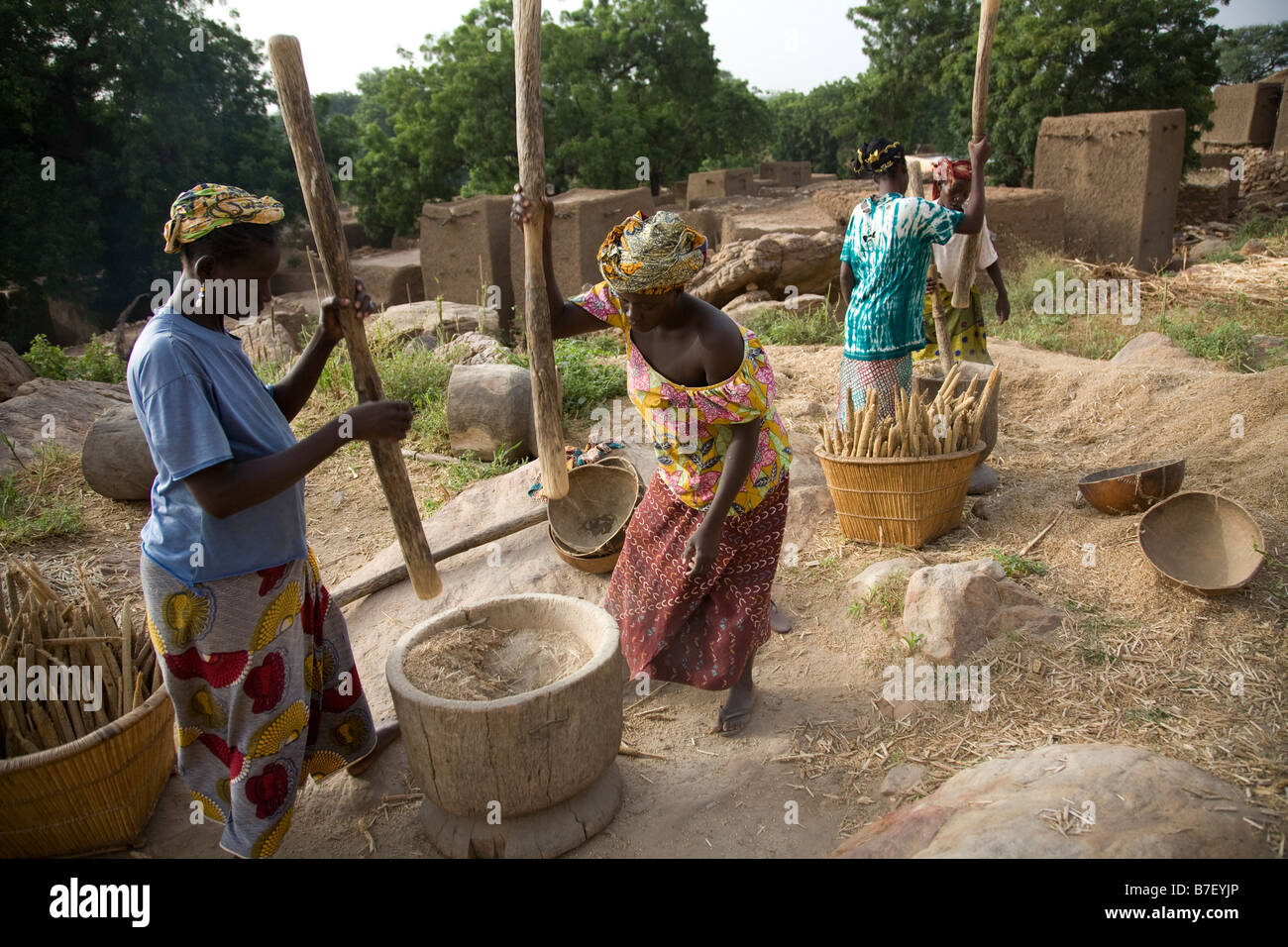 Pounding millet in the Dogon Valley Stock Photo