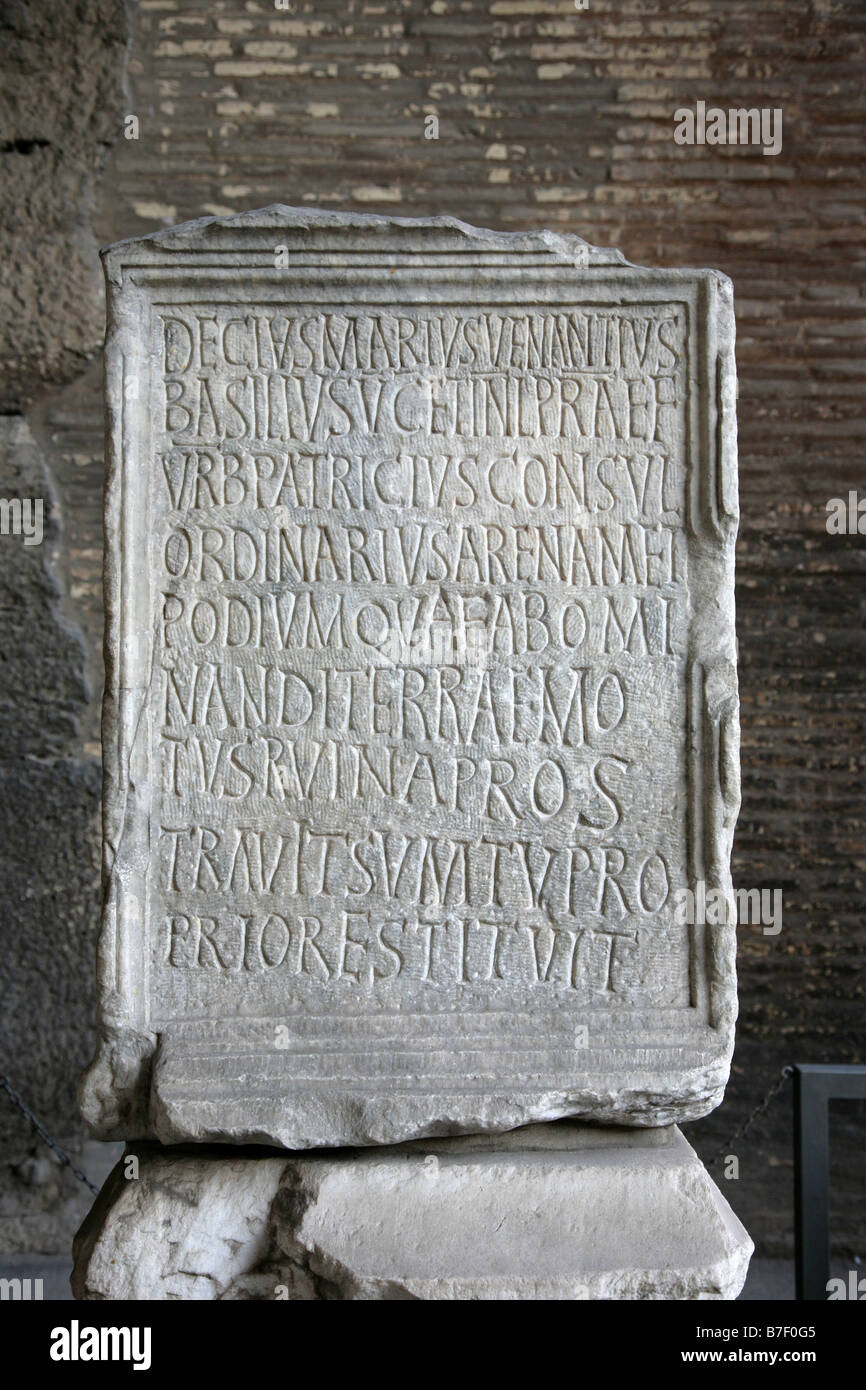 Text on a stone in Coliseum Rome Stock Photo - Alamy