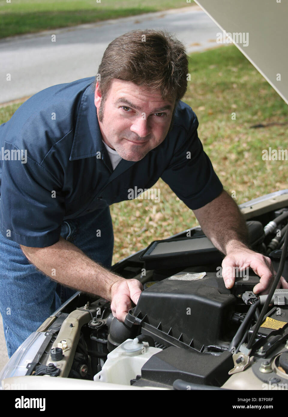 Car Under Hood Close Up, View Of A Red Engine With Big Black Round Air  Intake Filter, Tubes, Wires, Pipes, Mechanical And Electrical Other Parts  Stock Photo, Picture and Royalty Free Image.