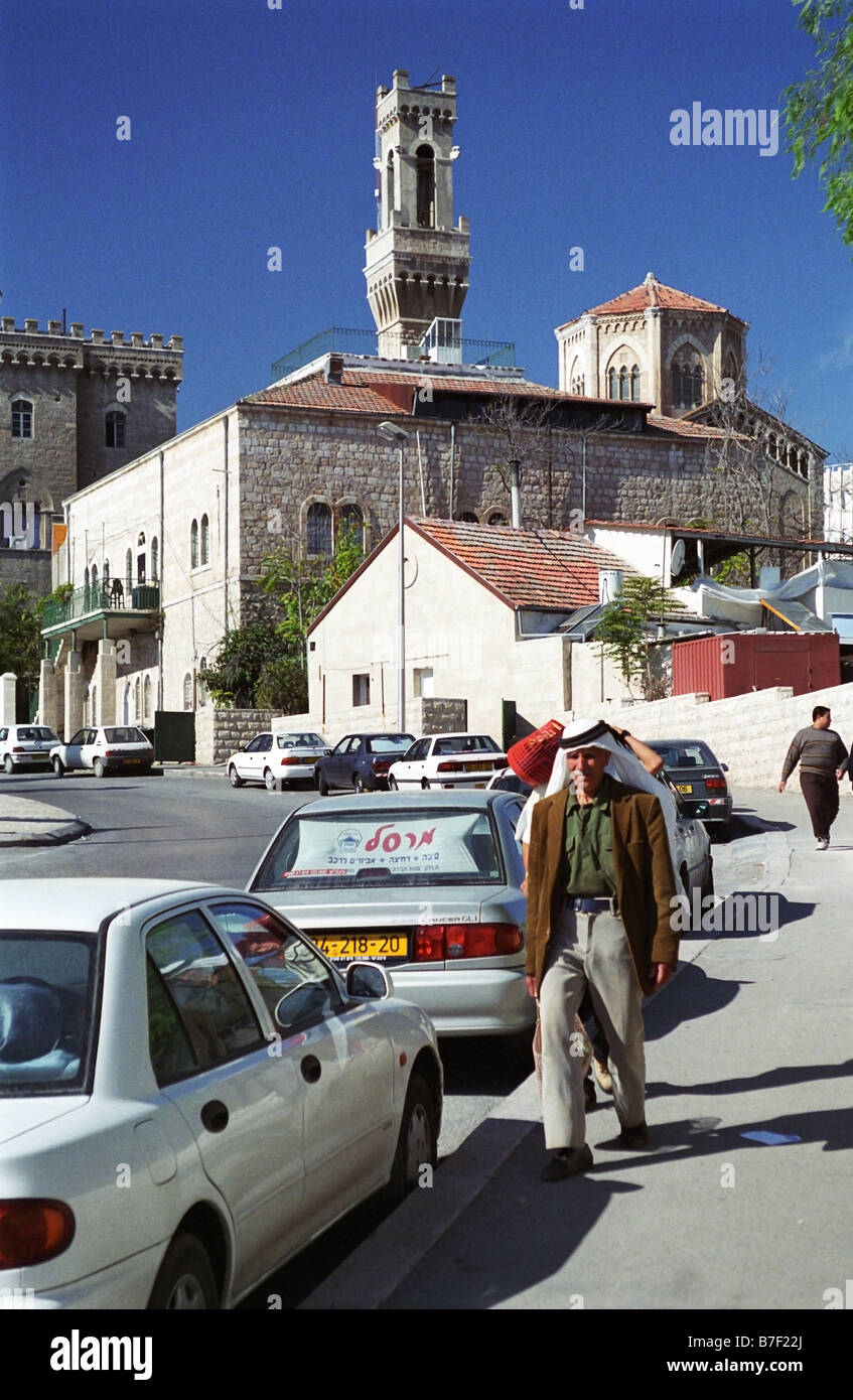 An Arab man walks toward East Jerusalem from West Jerusalem Stock Photo