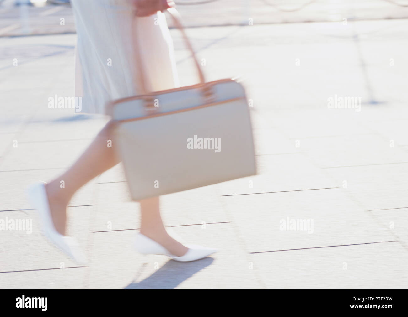 Exiting woman walking sidewalk hi-res stock photography and images - Alamy