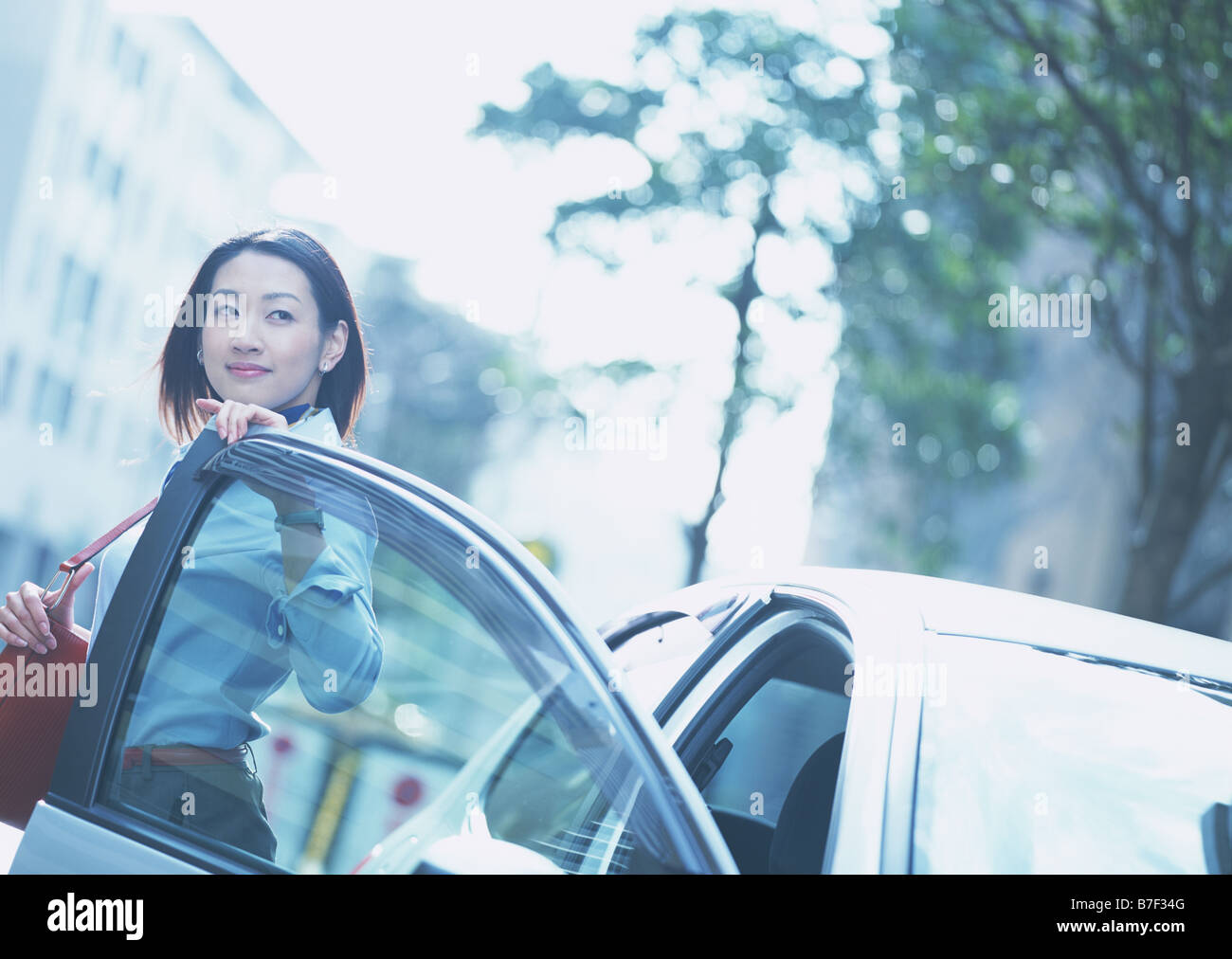 Woman turning around car hi-res stock photography and images - Alamy