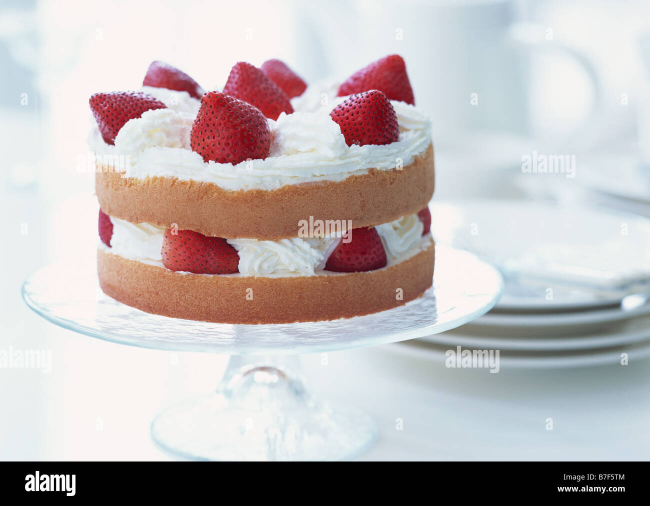 Strawberry shortcake on stand Stock Photo - Alamy