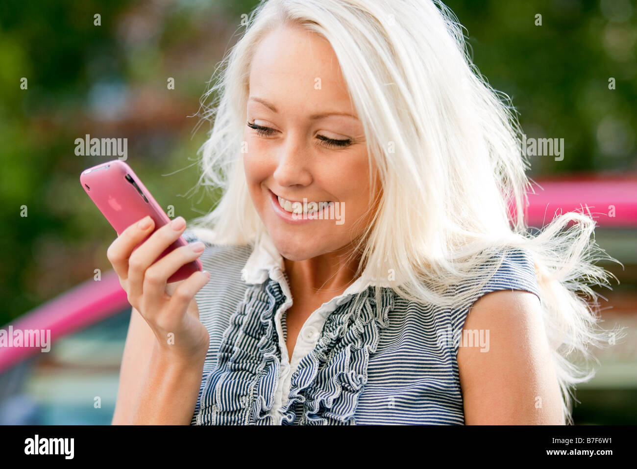 Girl reading message on mobile phone Stock Photo Alamy