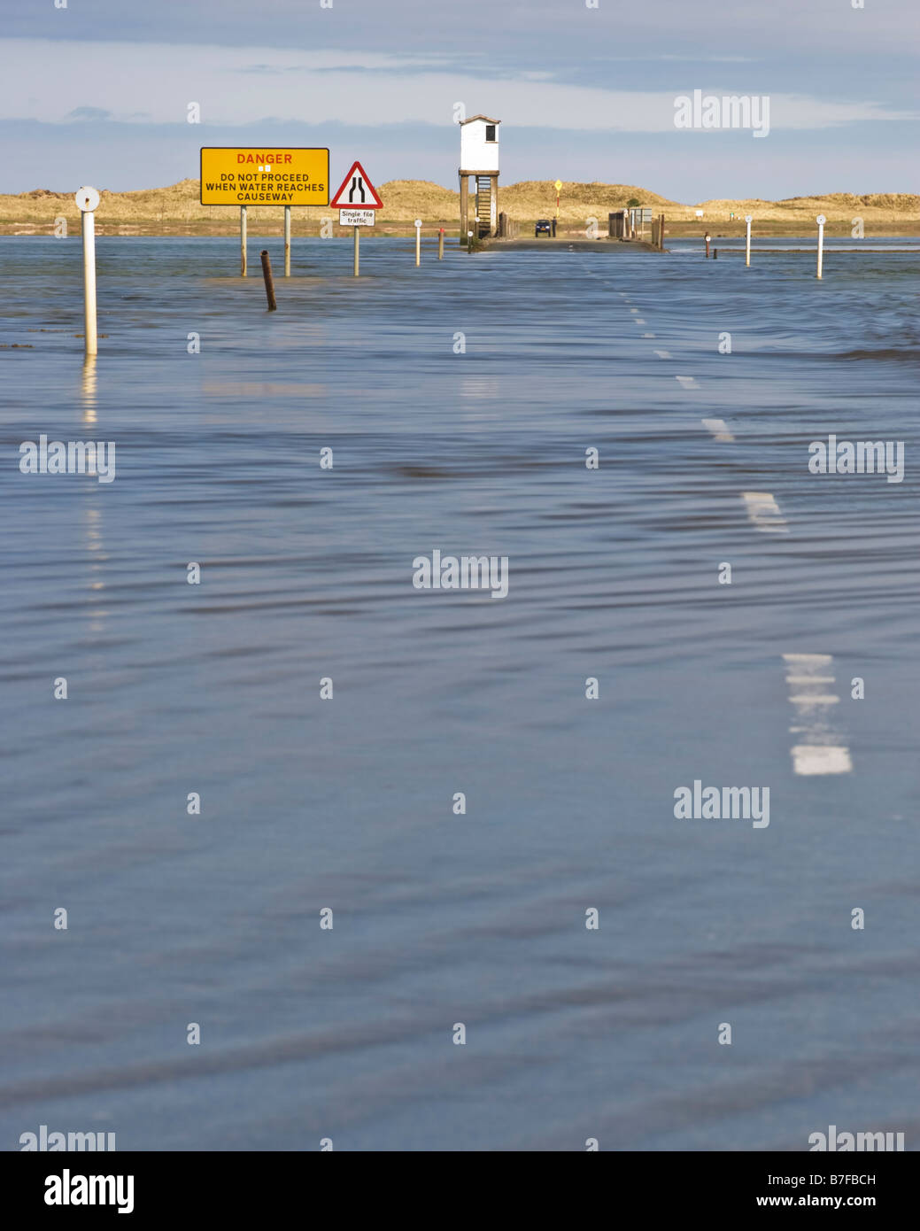 The water covered causeway across to Lindisfarne (Holy Island) at high tide, Northumberland, England Stock Photo
