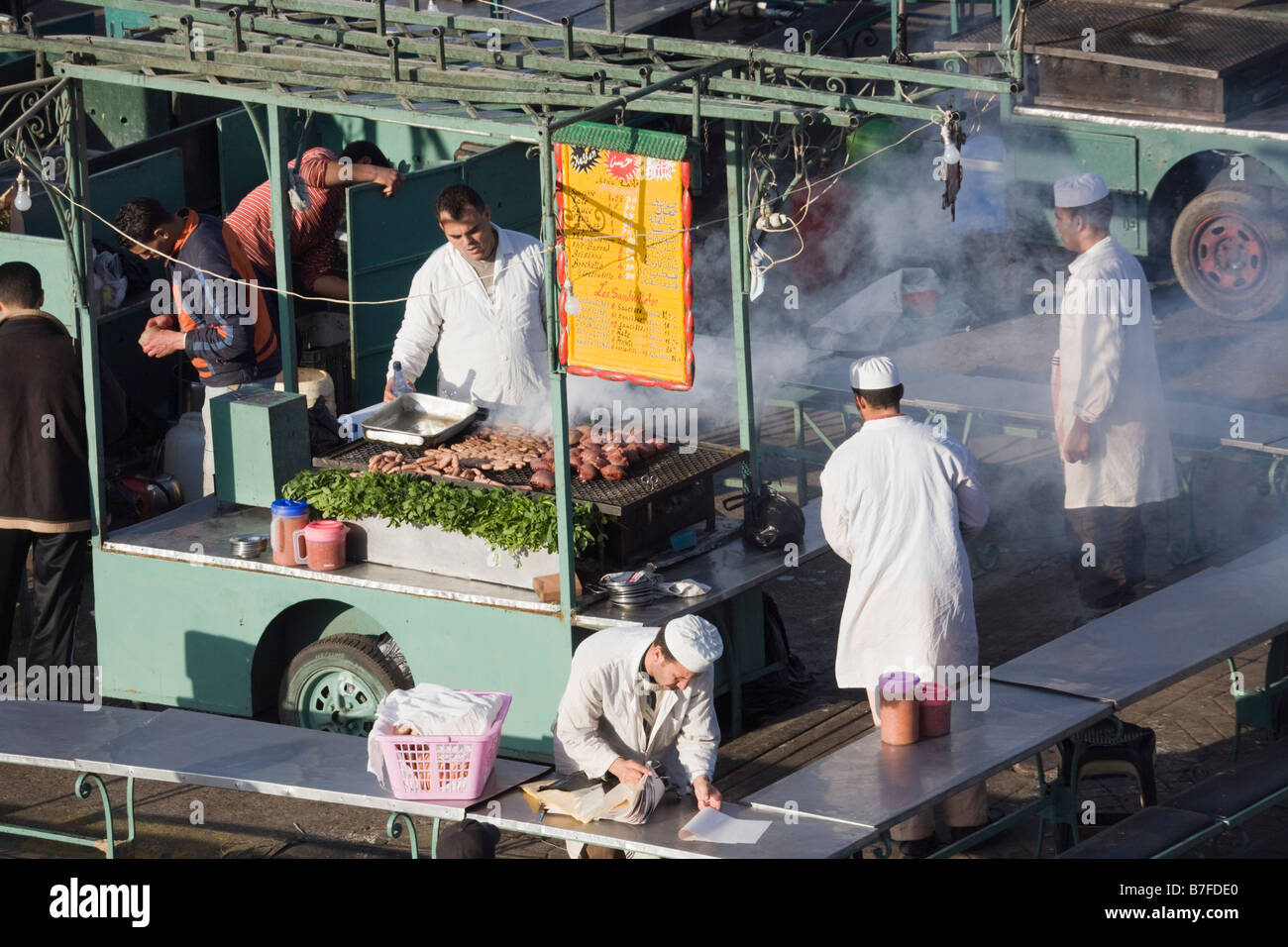 Marrakech Morocco North Africa Cooked food stall cooking in Place Djemma el Fna square in the evening in the Medina Stock Photo