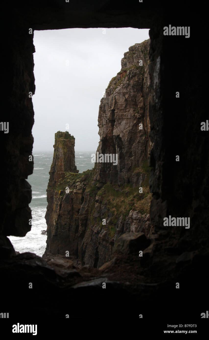 View of sea and cliffs through window of "St Govan's Chapel ...