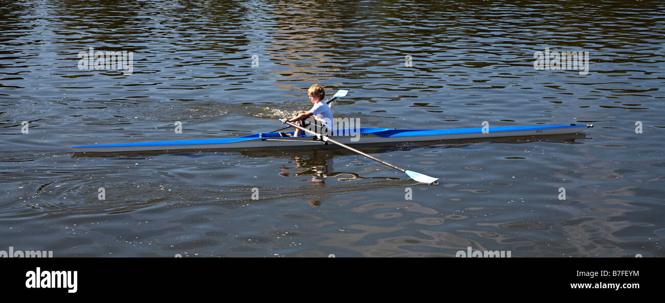 Young boy rowing skiff on watersportbaan Ghent Belgium Stock Photo
