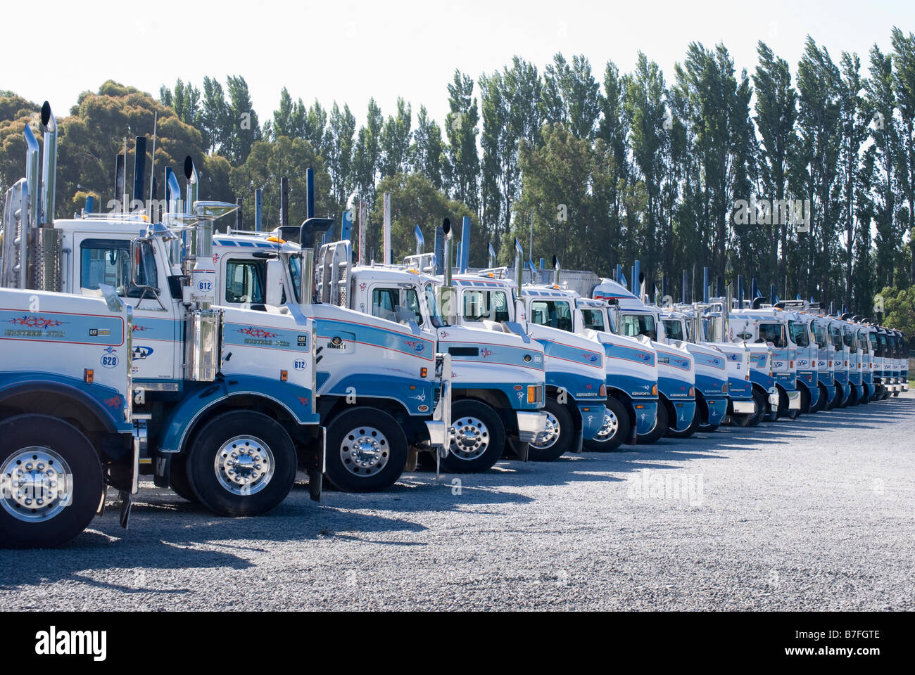 Modern fleet of log & bulk transport trucks, Main North Road, Kaiapoi, Canterbury, New Zealand Stock Photo