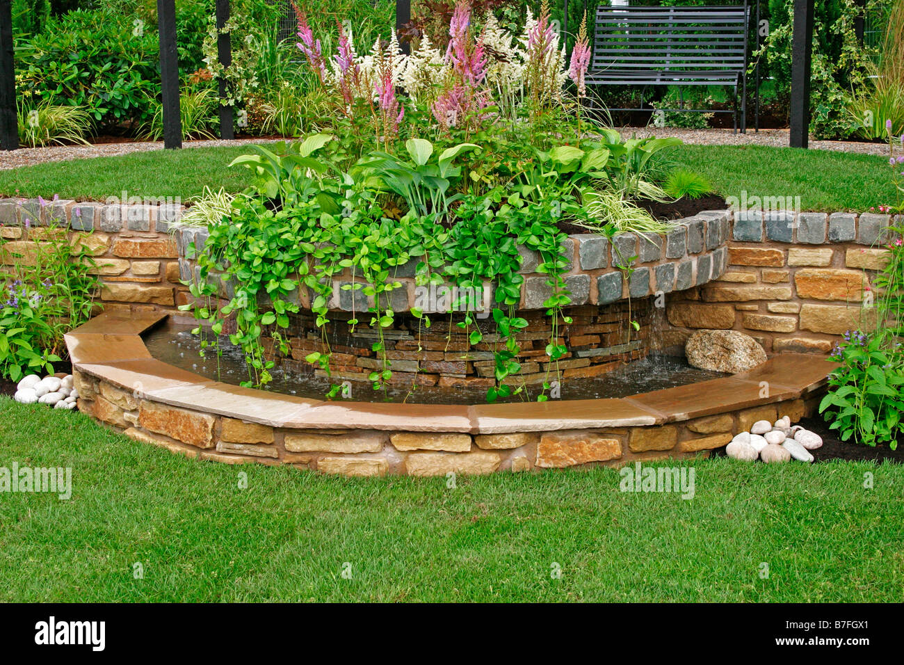 WATER FEATURE USING STONE AND TRAILING PLANTS Stock Photo Alamy