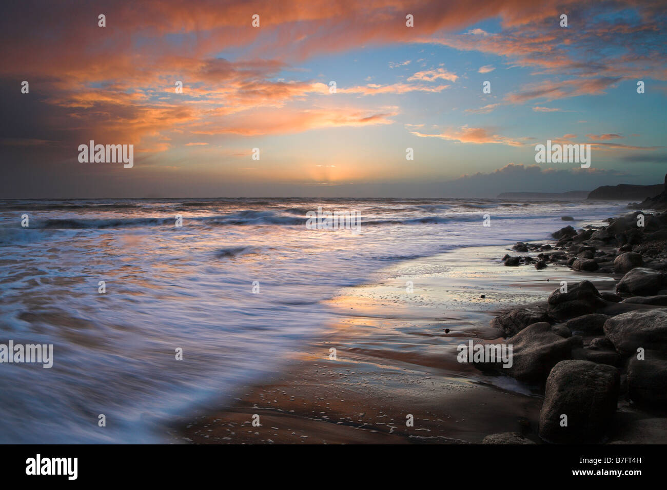 Sunset at rocky beach, Isle of Wight Stock Photo