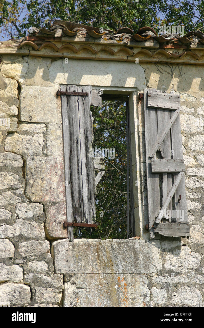 Old wooden shutters in a stone wall Stock Photo - Alamy