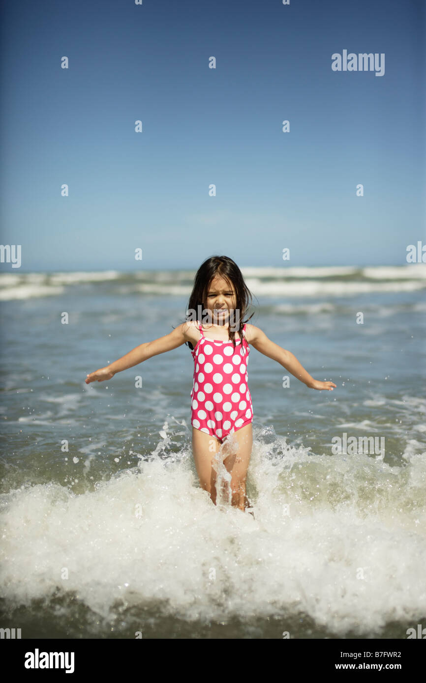 Five year old girl plays at the beach, Himatangi, New Zealand Stock Photo