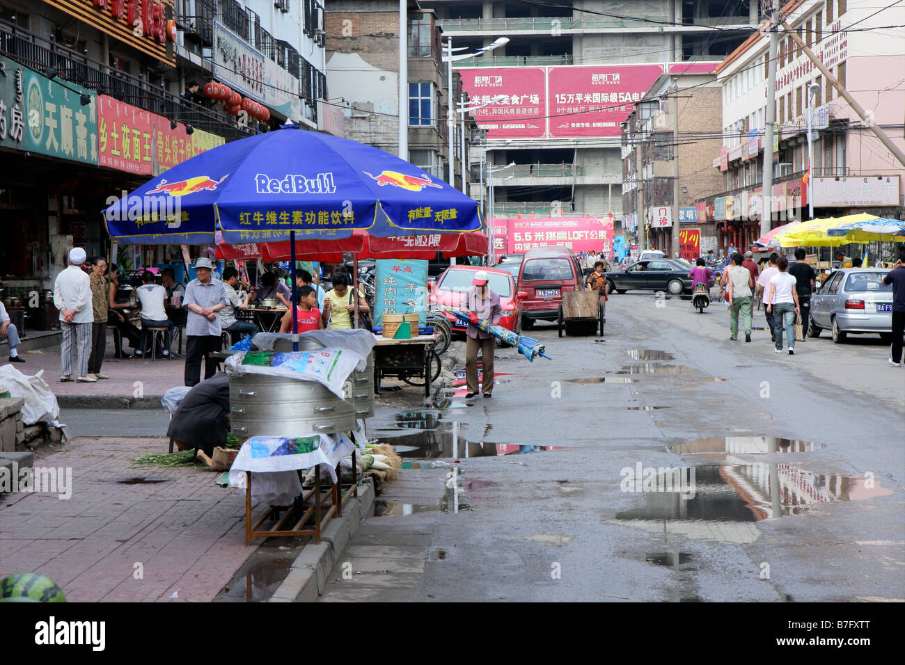 A bustling street with street vendors in the town of HoHot, Inner Mongolia, northern China Stock Photo