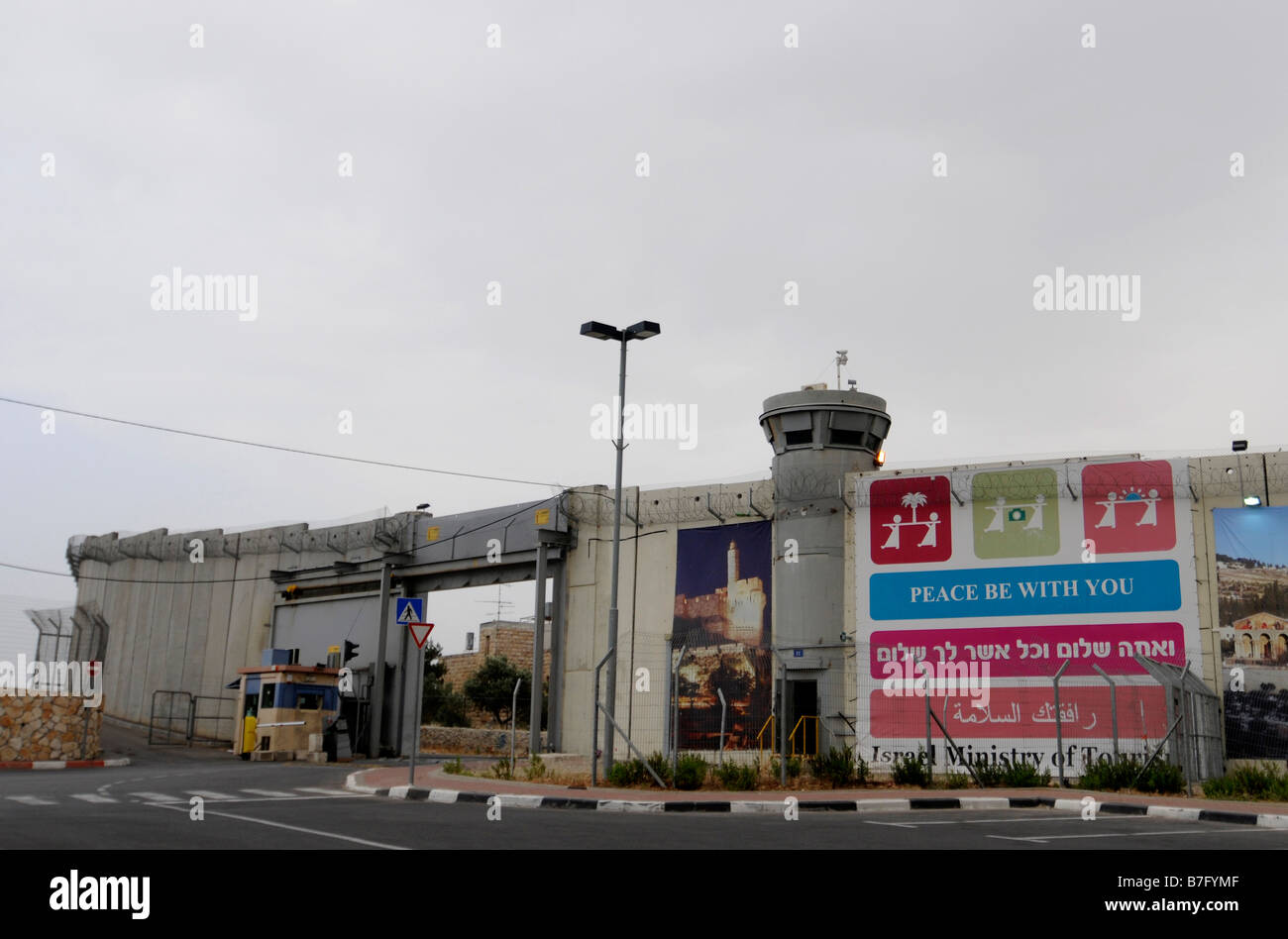 A tourism advertisment on the 'security fence', a wall built by the Israelis to separate themselves from the Palestinians. Stock Photo