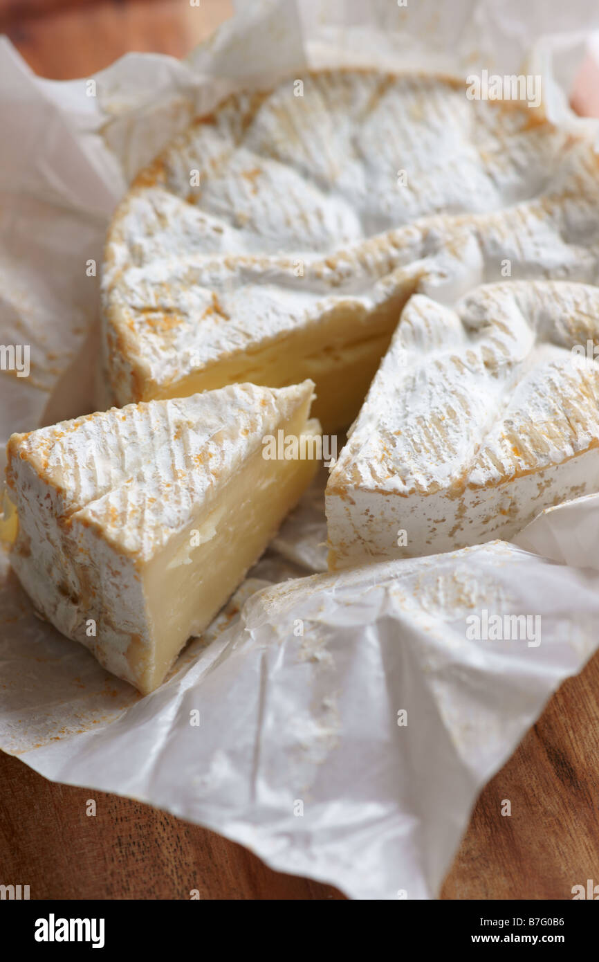 whole camembert with a piece cut out Stock Photo