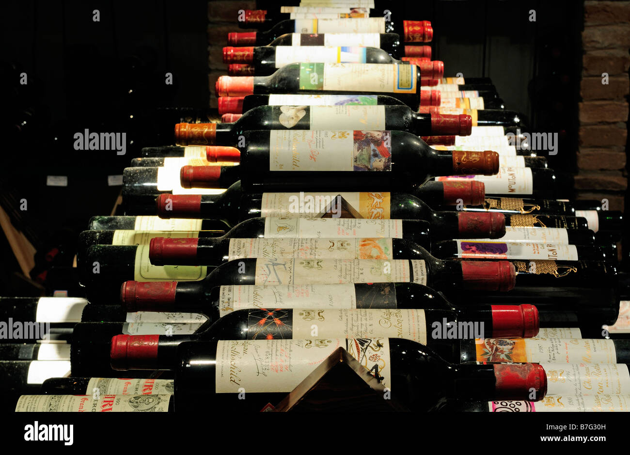 A selection of fine French red wines in a cellar Stock Photo Alamy