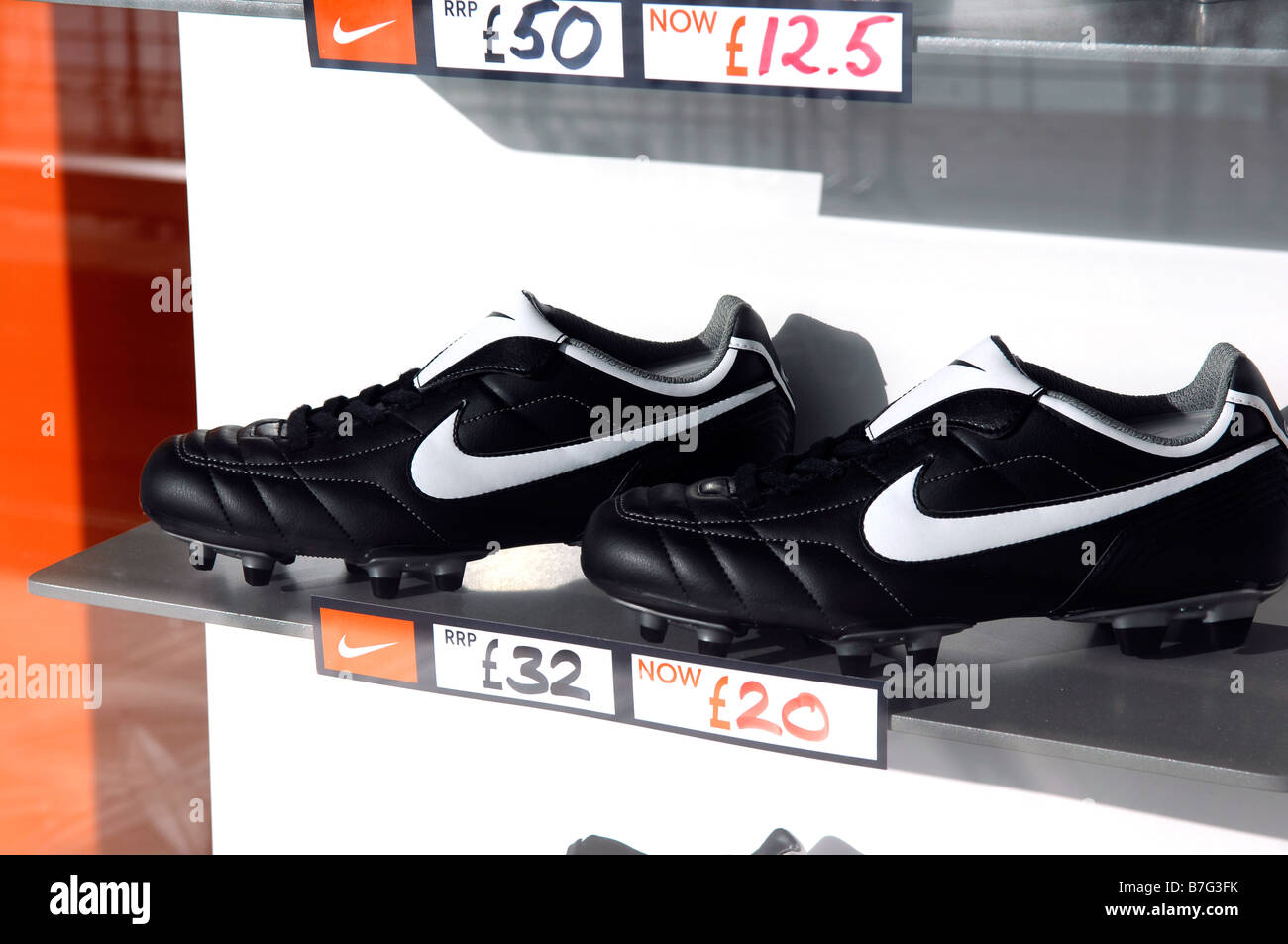 nike footwear football boots soccer shoes window display reduced american  company fashion retail shop store niketown Stock Photo - Alamy