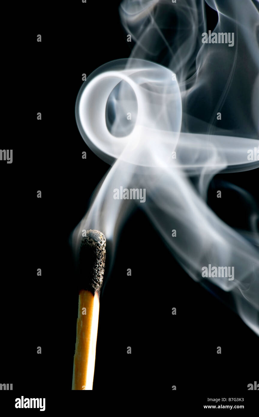 object on black match with smoke Stock Photo Alamy