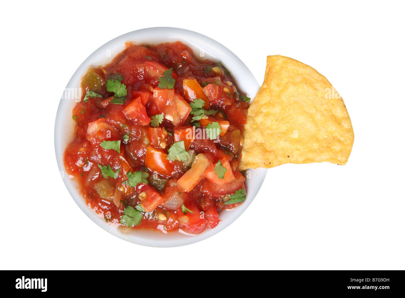Salsa and tortilla chip cut out on white background Stock Photo