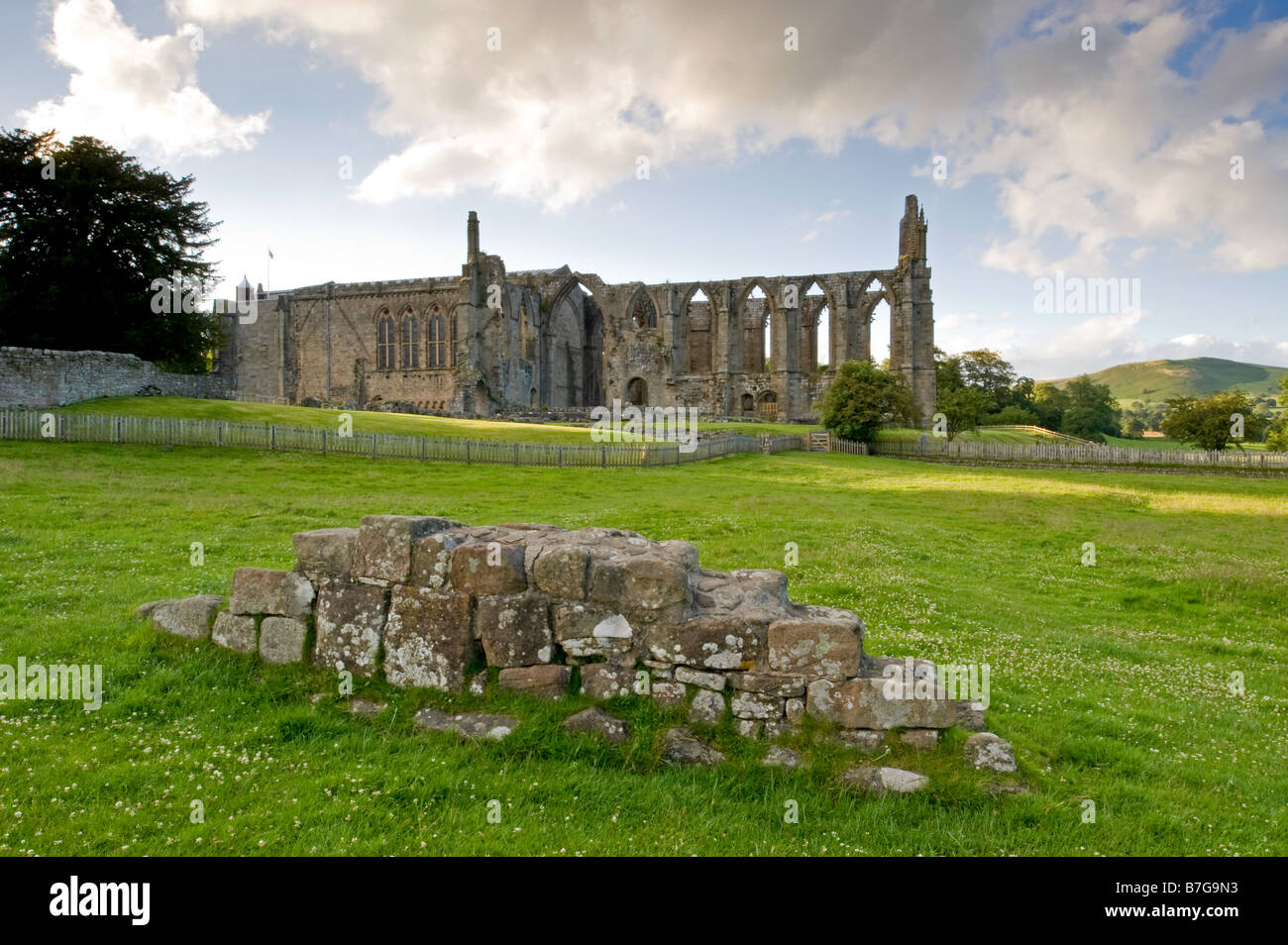 Summer view from south of ancient, picturesque monastic ruins of Bolton Abbey & priory church, in scenic countryside - Yorkshire Dales, England, UK. Stock Photo