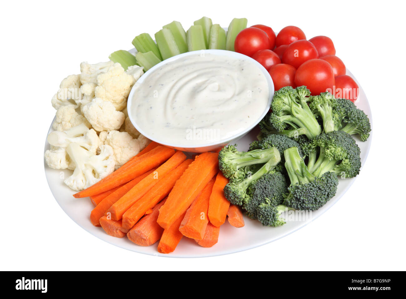 Vegetable tray with cauliflower celery tomatoes broccoli carrot sticks and ranch dip Stock Photo