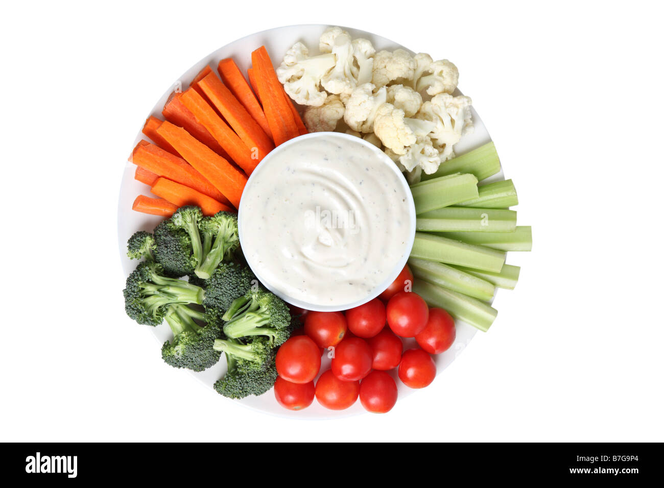 Vegetable platter with cauliflower celery tomatoes broccoli carrot sticks and ranch dip Stock Photo