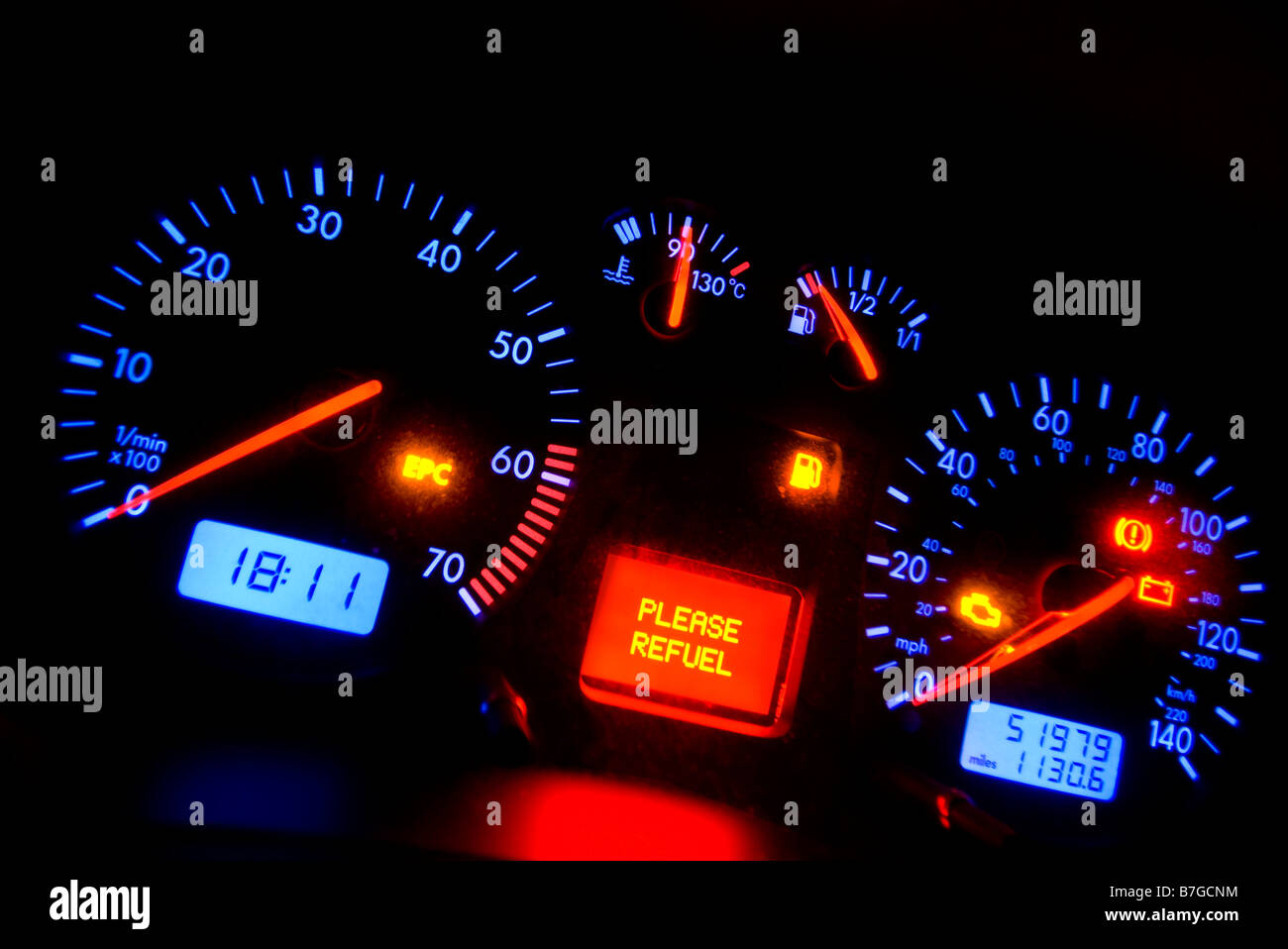 car dashboard showing refuel light Stock Photo