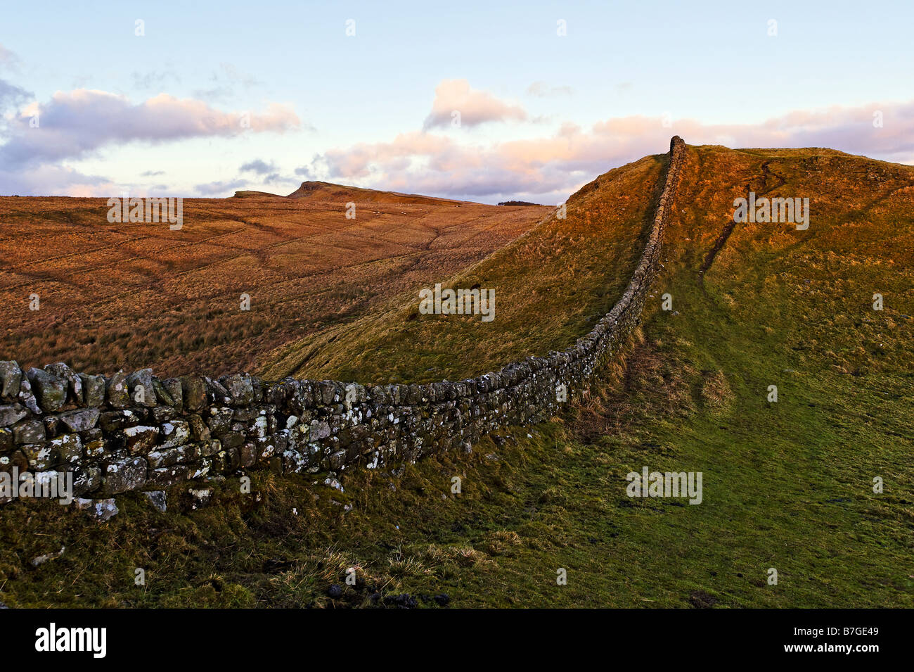 Looking east along the line of Hadrian'  Wall from a spot near Housesteads. Sewingshields Crags are visible on the skyline Stock Photo
