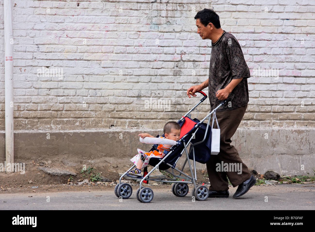 Man pushing a pram hi-res stock photography and images - Alamy