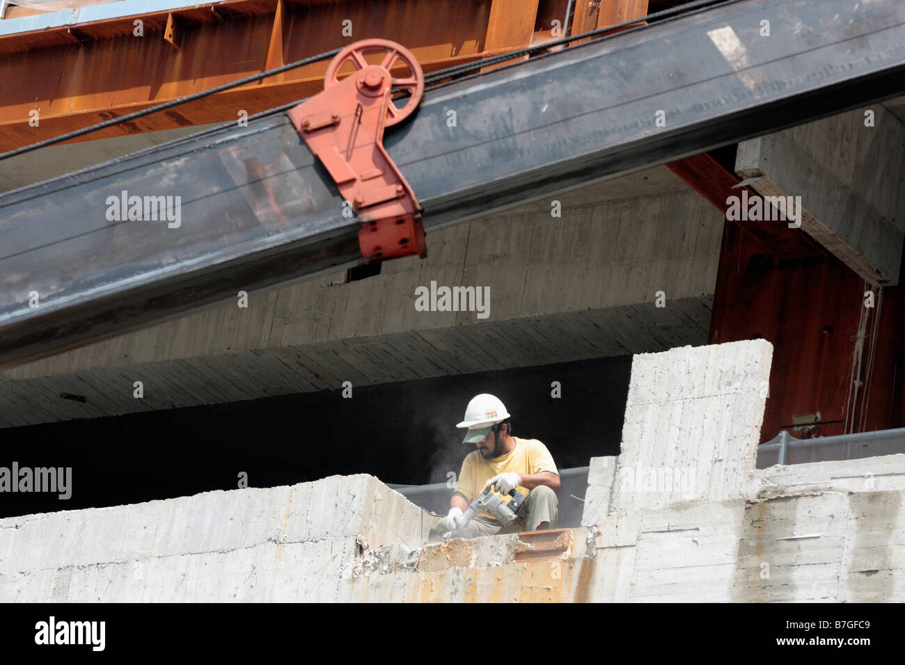 Worker works at construction site Stock Photo - Alamy