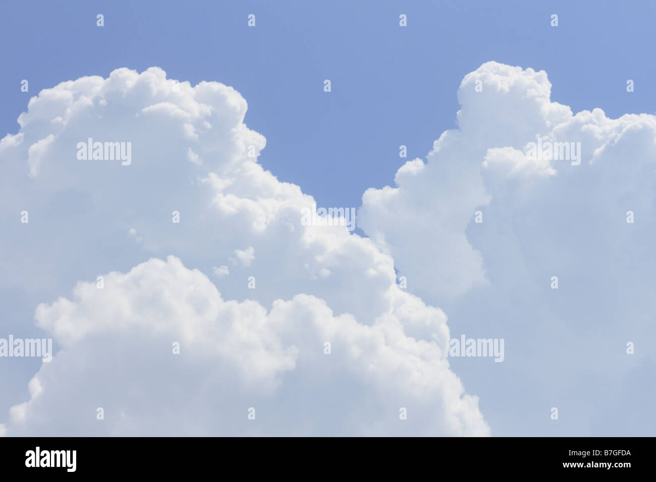 white fluffy cumulus fine weather clouds in the sky Stock Photo