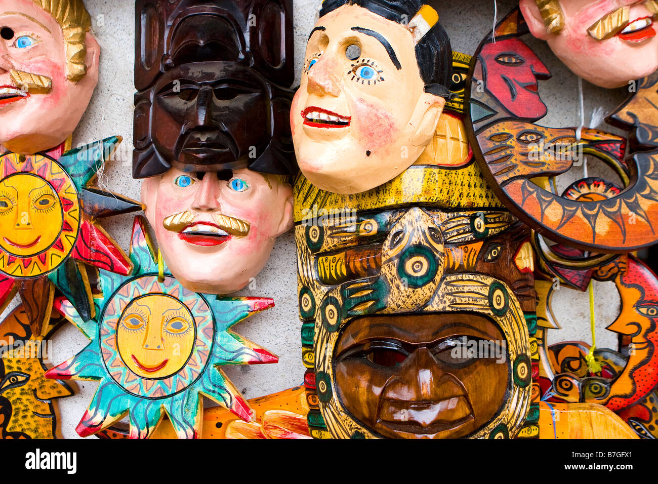 Close up of traditional Guatemalan masks and handicrafts at market in
