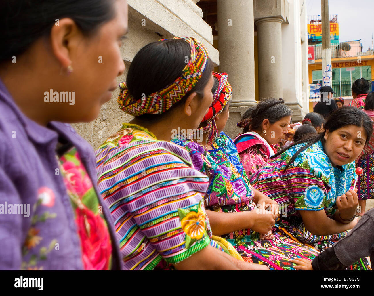 A group of Guatemalan woman in traditional dress sit and talk in Zunil Guatemala in the Western Highlands Stock Photo Alamy