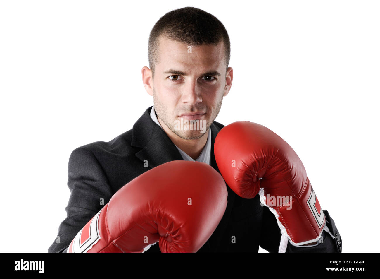 Businessman wearing boxing gloves Stock Photo Alamy