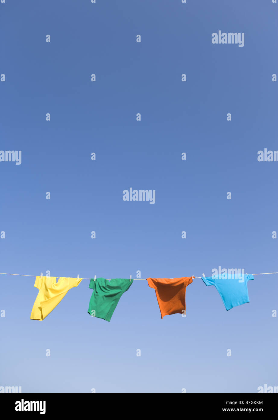 Tshirts hanging on clothesline Stock Photo Alamy