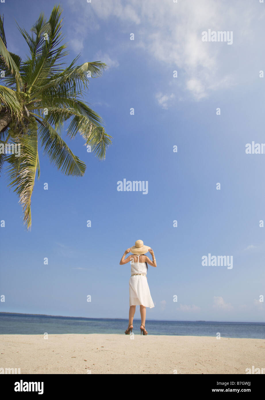 Woman standing on beach Stock Photo Alamy
