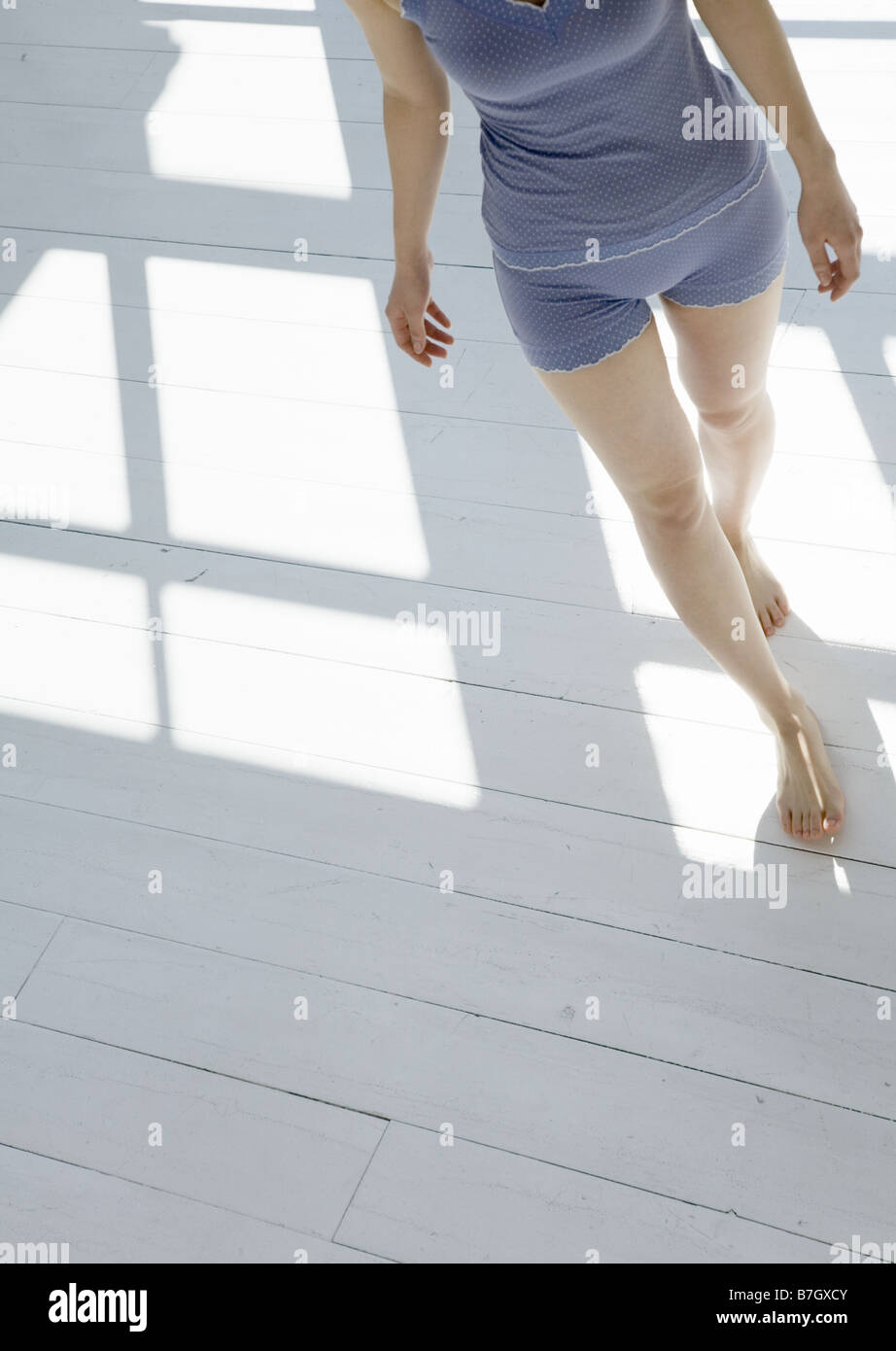 Woman barefoot walking indoor hi-res stock photography and images - Alamy