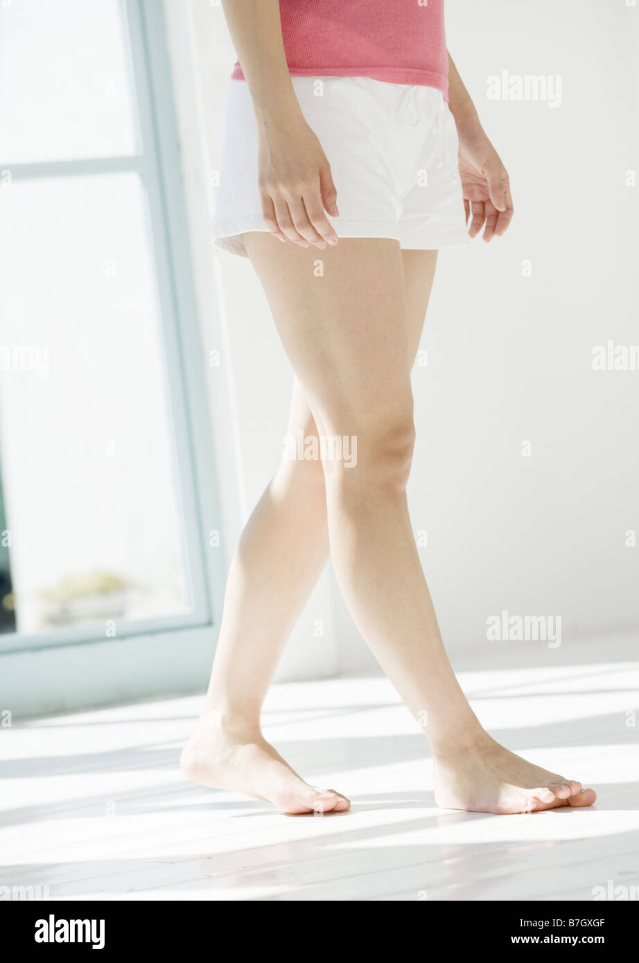 Woman barefoot walking indoor hi-res stock photography and images - Alamy