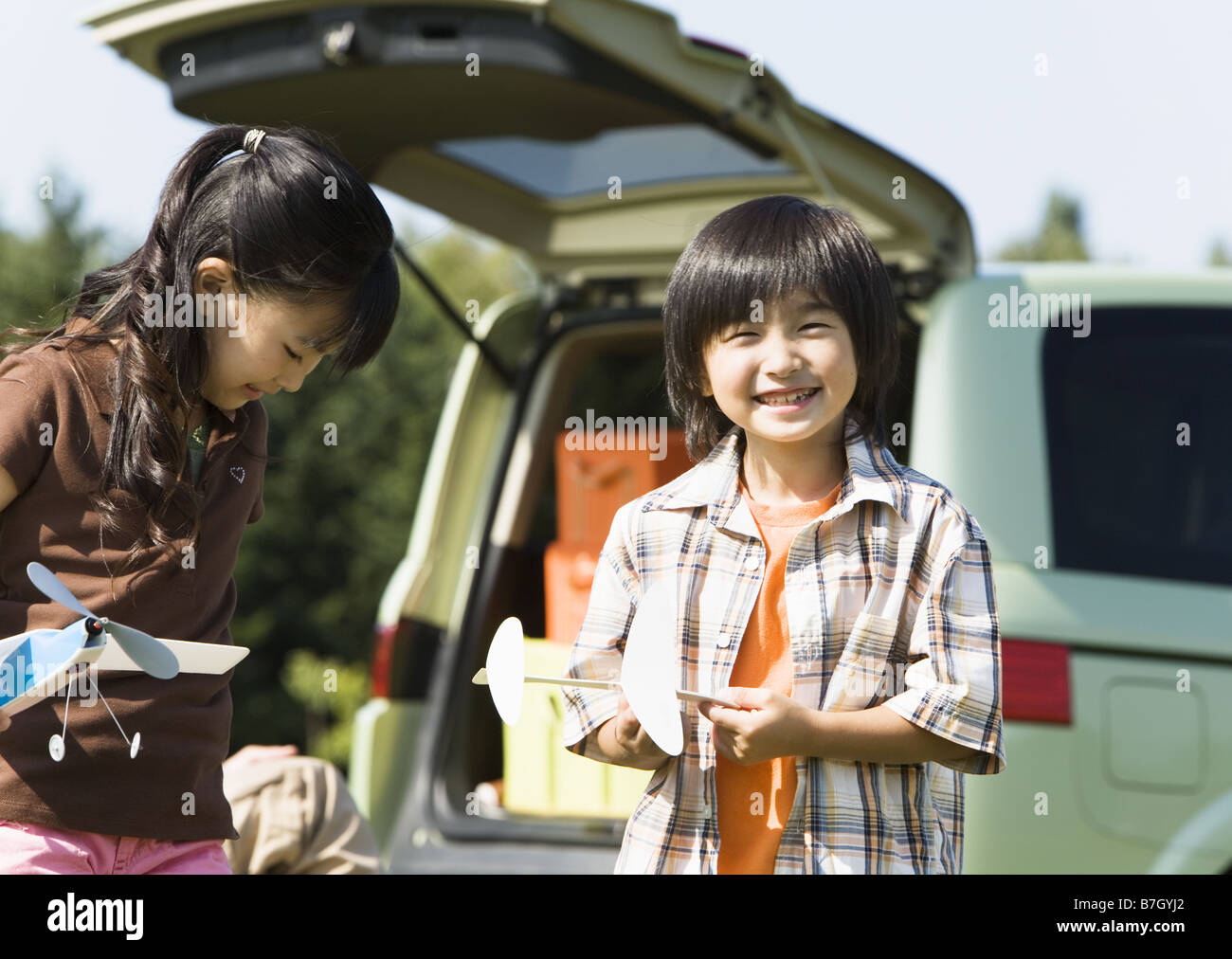 Children playing with toy plane Stock Photo - Alamy