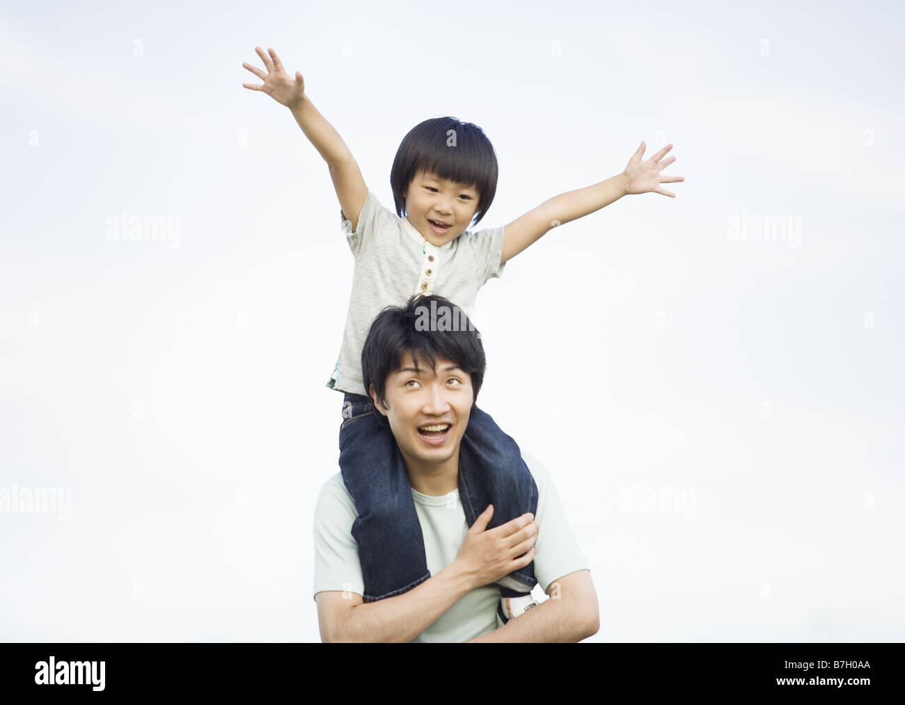 Father carrying son on his shoulders Stock Photo - Alamy